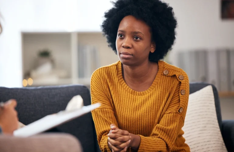 A woman participates in CBT therapy.