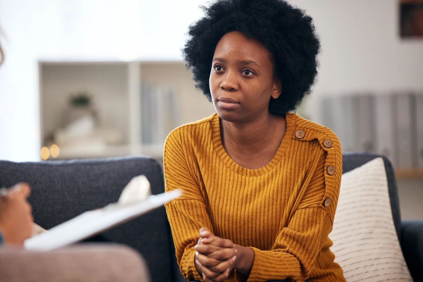 A woman participates in CBT therapy.
