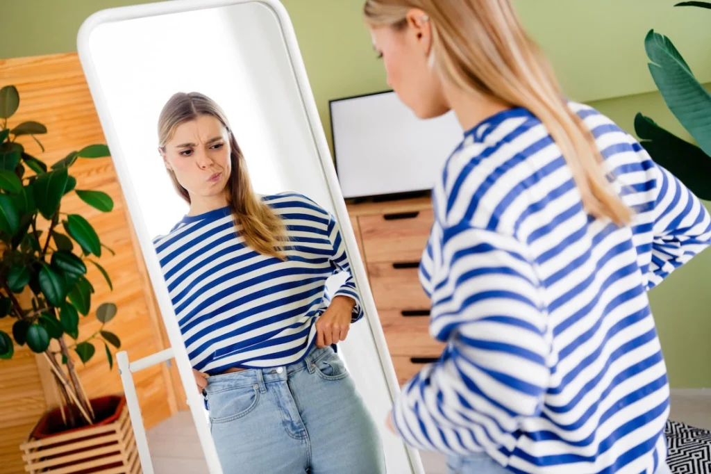 A woman struggles with body image issues.