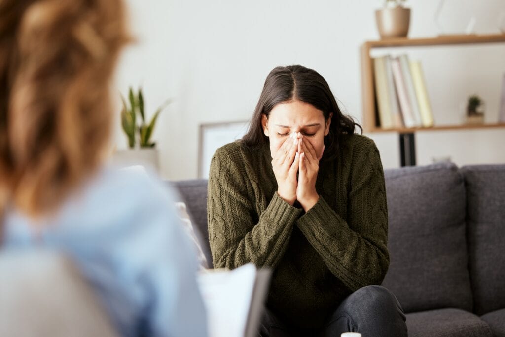 Woman finding the benefits of trauma therapy for women​.