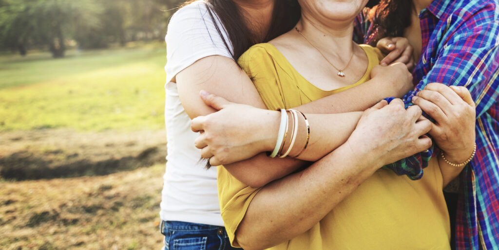 Women hugging at the fall family summit.