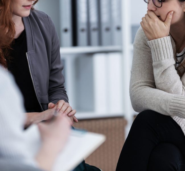 Sad,Girl,With,Psychotherapist.,Women's,Issues,Support,Group,Concept