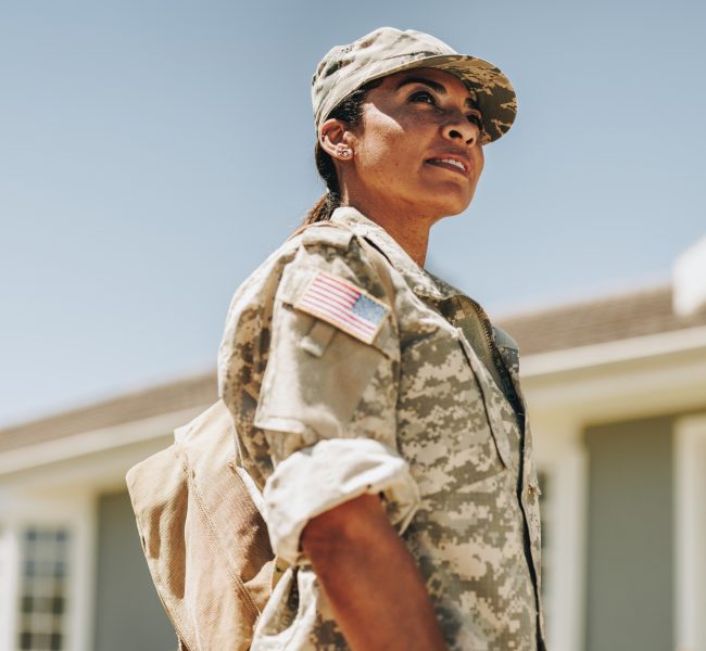 Courageous,Female,Soldier,Looking,Away,Thoughtfully,While,Standing,Outside,Her